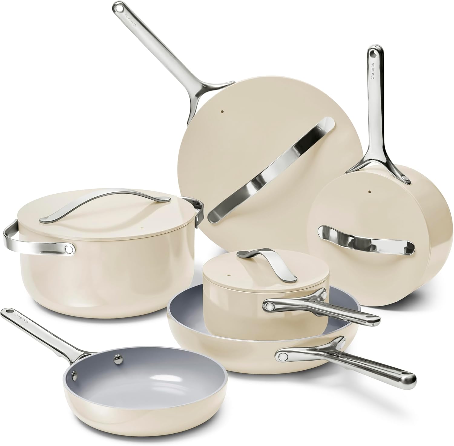 Caraway ceramic nonstick cookware set beside an induction cooktop